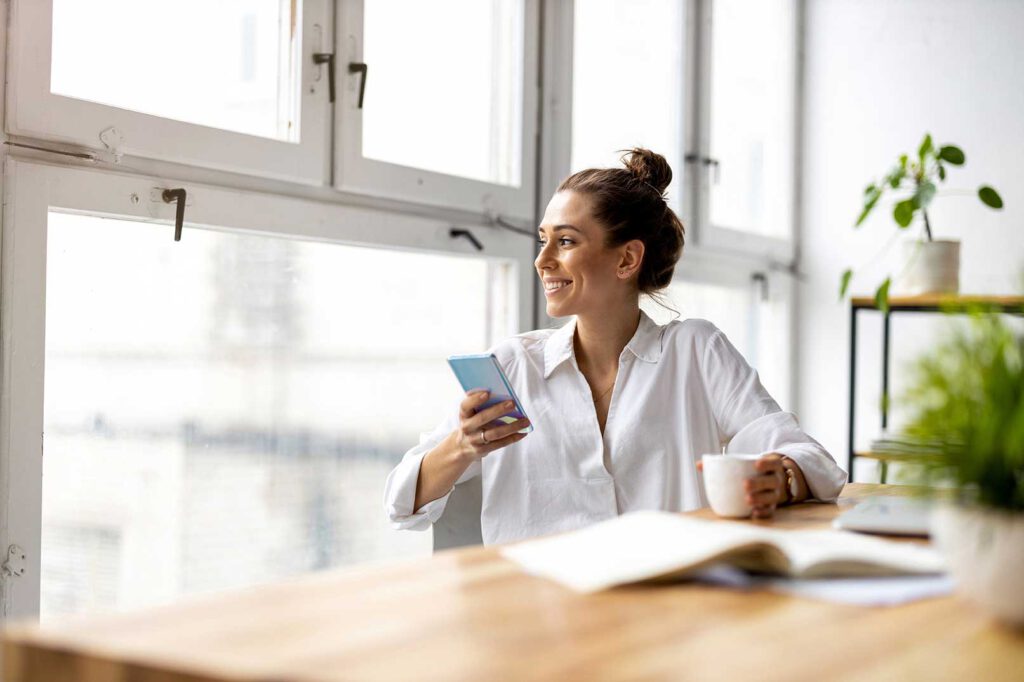 woman business owner relaxed having coffee